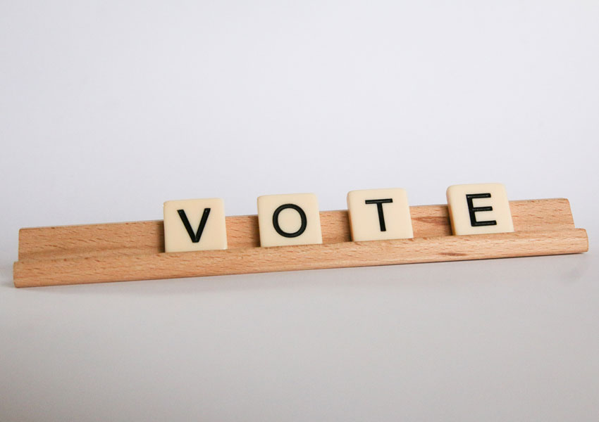 Vote spelt with lettered tile